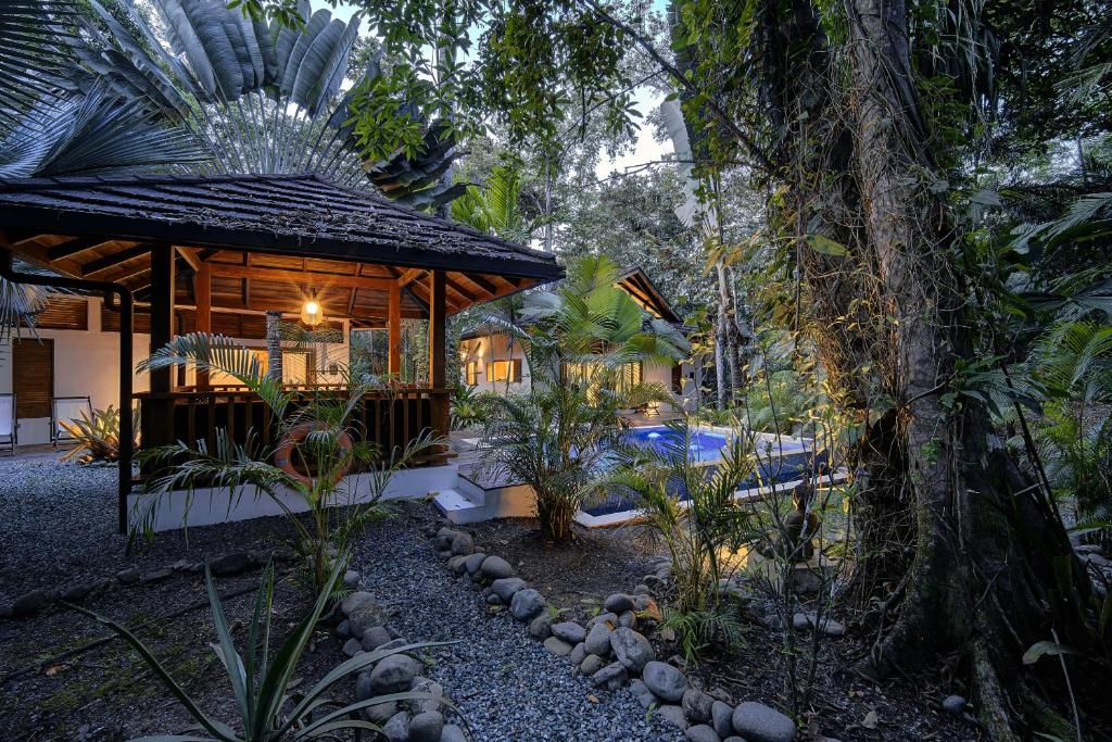 a house in the middle of a forest at Bodhi & Nirvana Houses in Talamanca