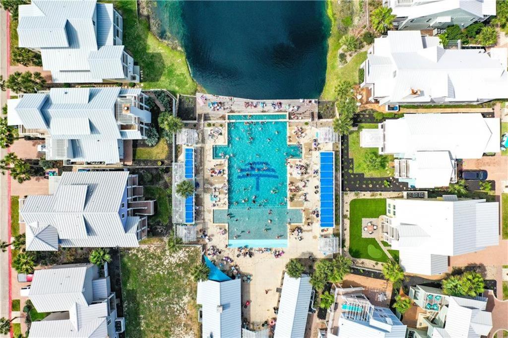 an aerial view of houses and a swimming pool at Coastal Reverie TC 6301 in Mustang Beach