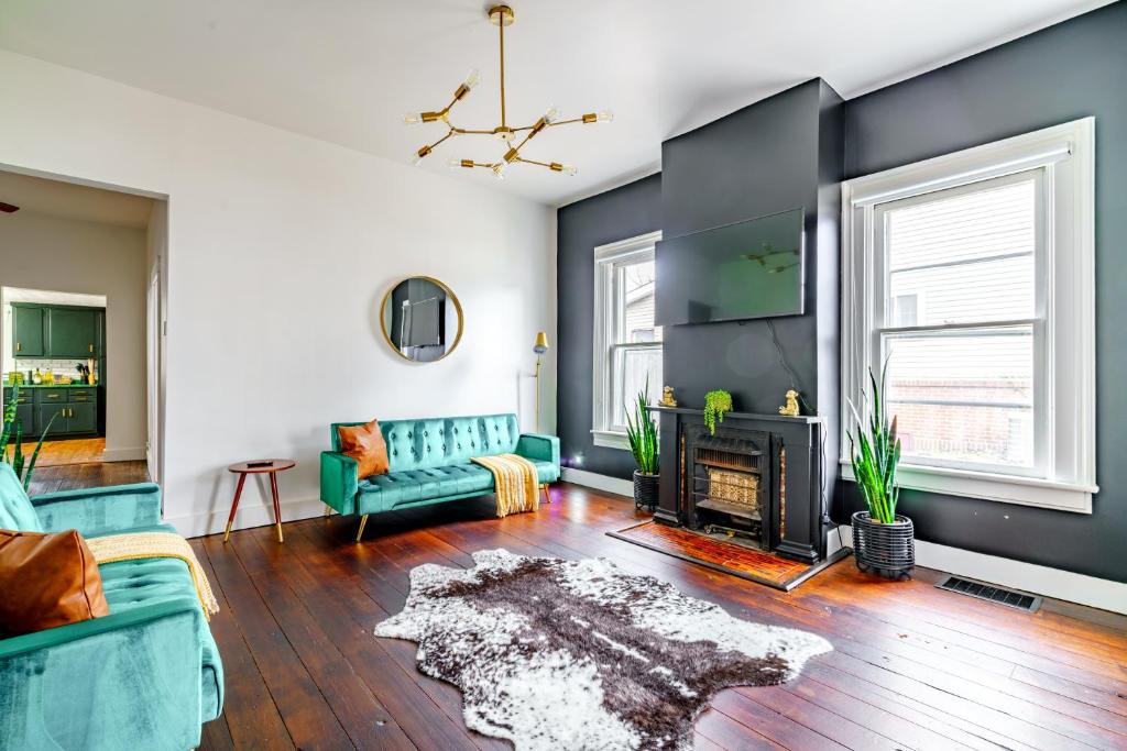 a living room with a couch and a fireplace at Prime Location Top Rated Clean Parking Free! in Chillicothe