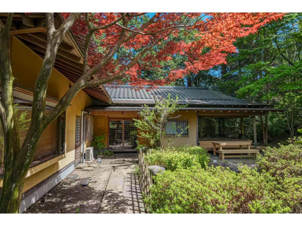 a house with a bench in front of it at Keyakizaka - Vacation STAY 12550v in Ogi