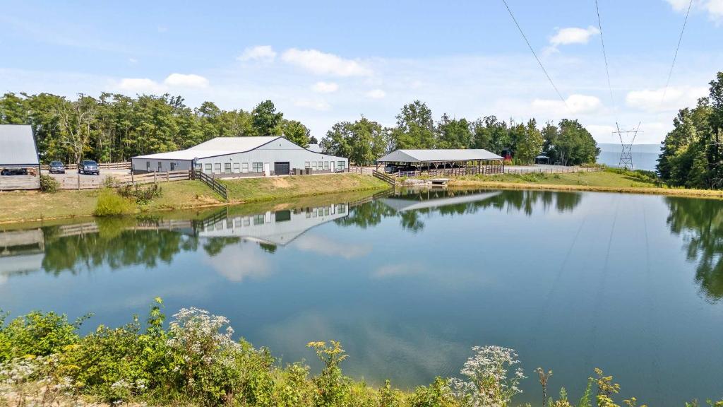 a large body of water with buildings in the background at Attitude Adjustment Cabin with hot tub fire pit & indoor pool in Bryant