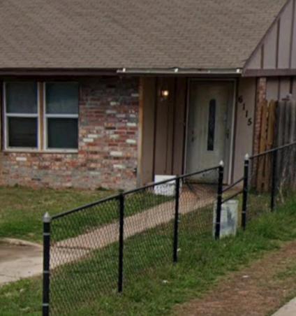 a house with a fence in front of a house at Romance rave in Oklahoma City