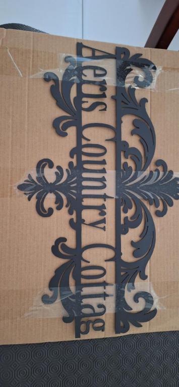 a box with a design on the side of it at Aeris Country Cottage in Junee