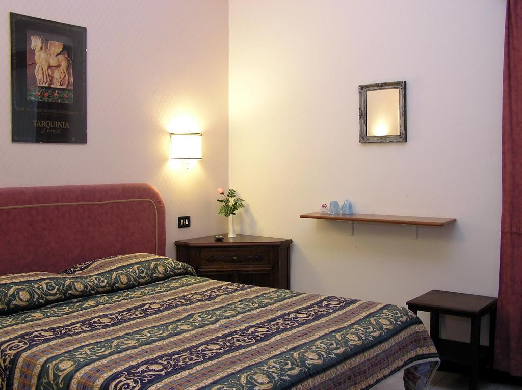 Postel nebo postele na pokoji v ubytování Hotel Ristorante Bagnaia