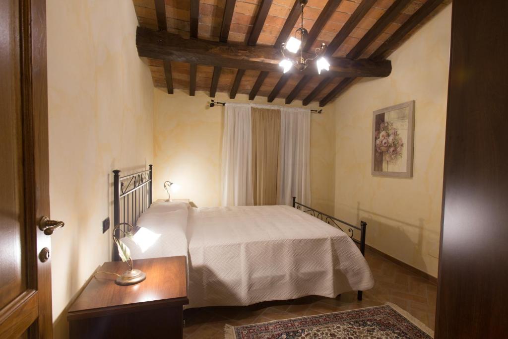 Postel nebo postele na pokoji v ubytování Borgo dei Gigli