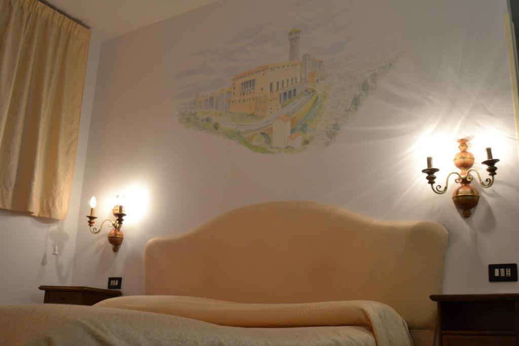 Postel nebo postele na pokoji v ubytování Hotel Ristorante Bagnaia