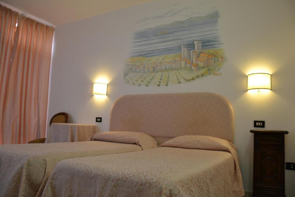 Postel nebo postele na pokoji v ubytování Hotel Ristorante Bagnaia