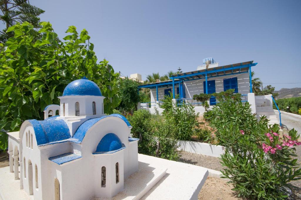 a blue and white building with a blue dome at Gialos Studios & Apartments in Ierapetra