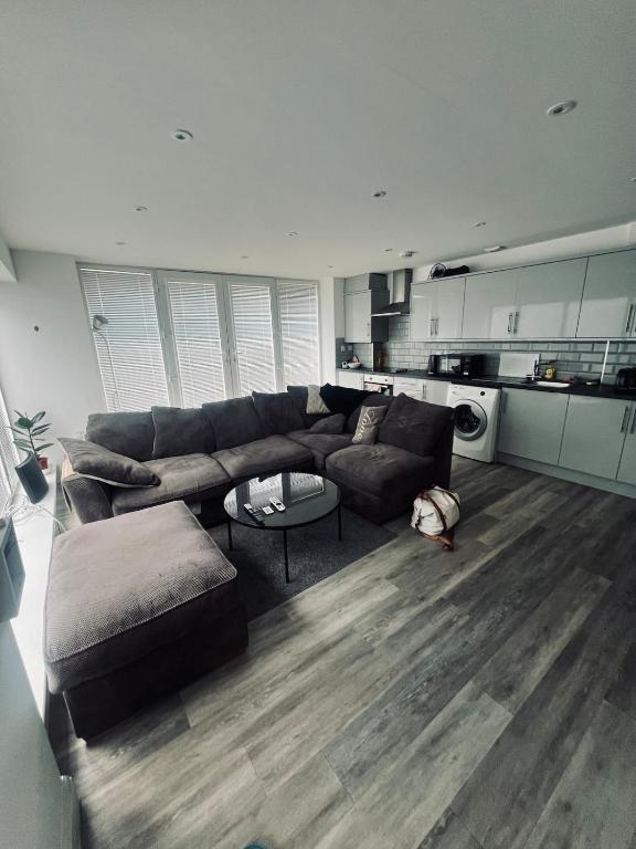 a living room with a couch and a table at One bed flat in Sunny Southend! in Southend