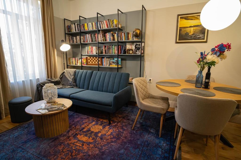 a living room with a couch and a table at The Nest in Ruse