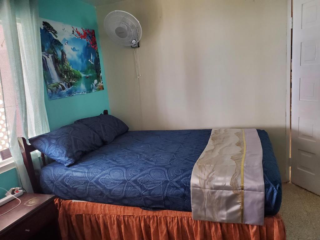a bedroom with a bed in a room with a desk at Bayview Luxury Retreat 