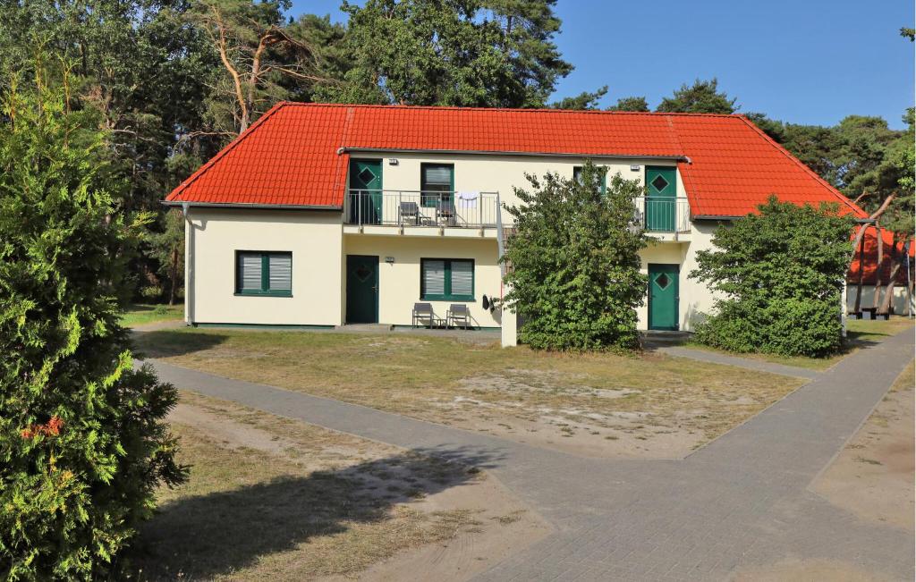 a white house with an orange roof at Amazing Apartment In Altenkirchen in Altenkirchen