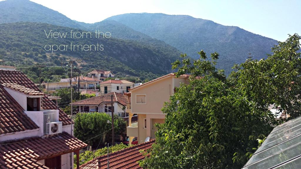 a view of a city with mountains in the background at Kristi in Póros Kefalonias