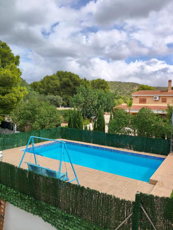 a swimming pool with a fence around it at Montevistas Retreat- Cycling, Hiking, Relaxation, Valencia 25 minutes in Valencia
