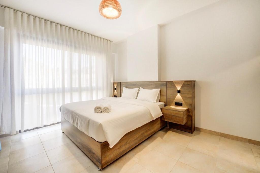Ένα ή περισσότερα κρεβάτια σε δωμάτιο στο Al-Raha Luxury apartment