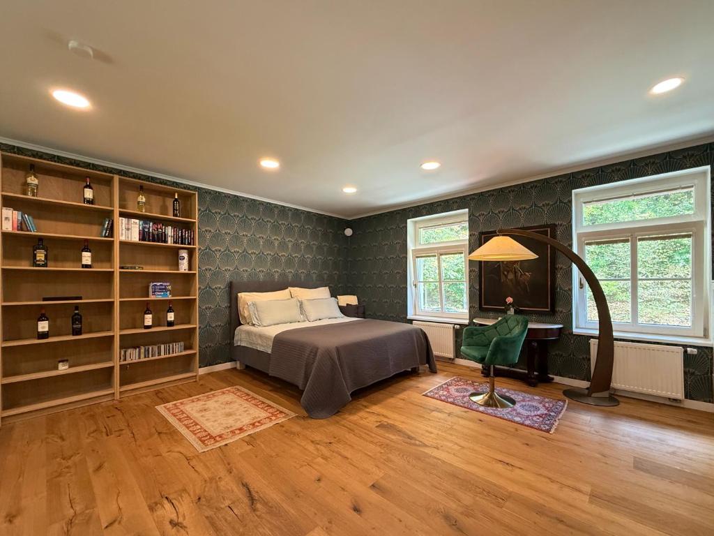 a bedroom with a bed and a book shelf at Mulino Apartments in Borek
