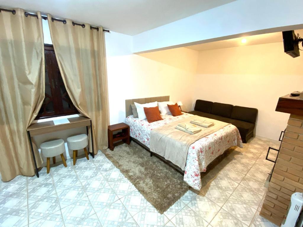 Giường trong phòng chung tại Villaggio Farnese