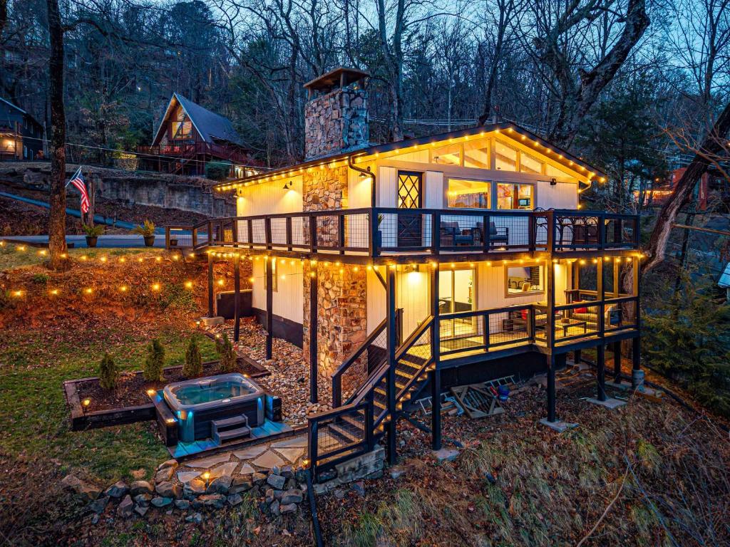 a house with lights on the front of it at Ober Lux Chalet in Gatlinburg
