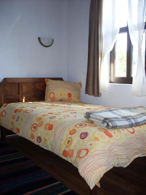 Postel nebo postele na pokoji v ubytování Tsutsovi House
