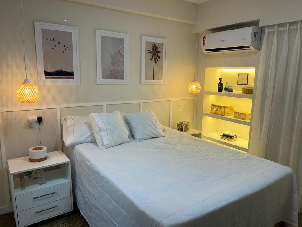 Ένα ή περισσότερα κρεβάτια σε δωμάτιο στο Flat av beira mar lindo e aconchegante