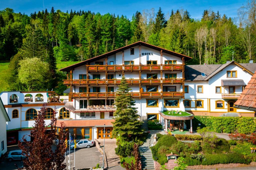 an aerial view of a hotel in the mountains at Holzschuhs Schwarzwaldhotel in Baiersbronn