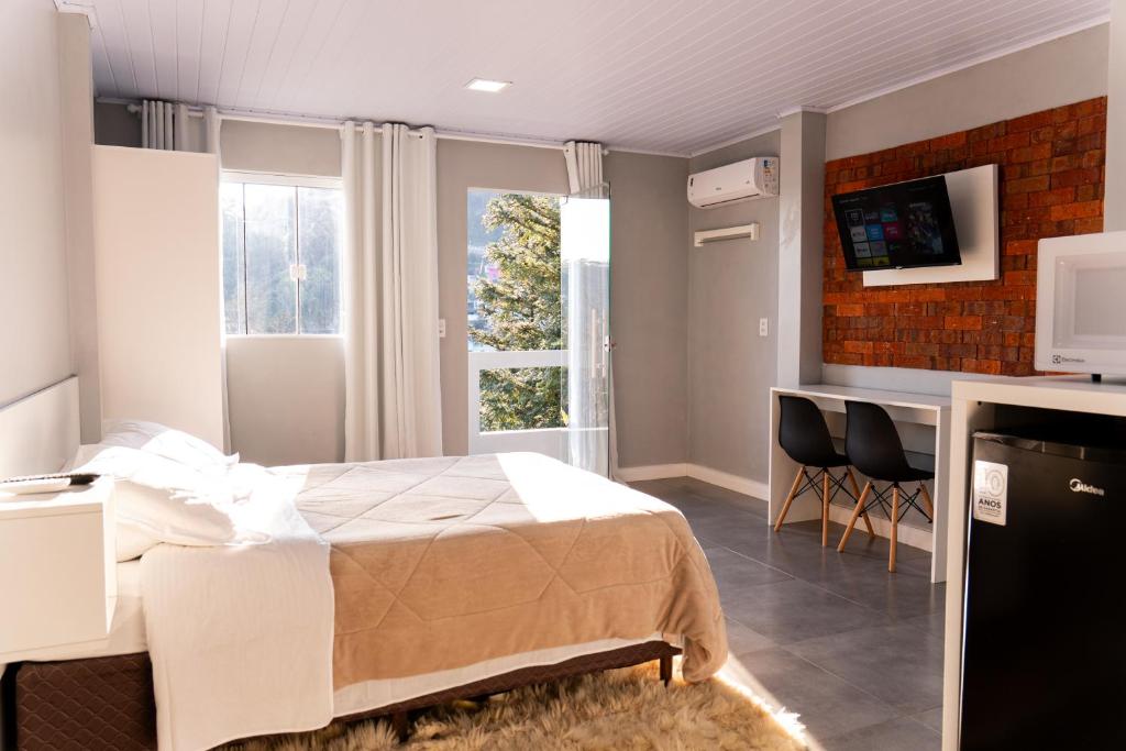 Una televisión o centro de entretenimiento en Vista da Serra.