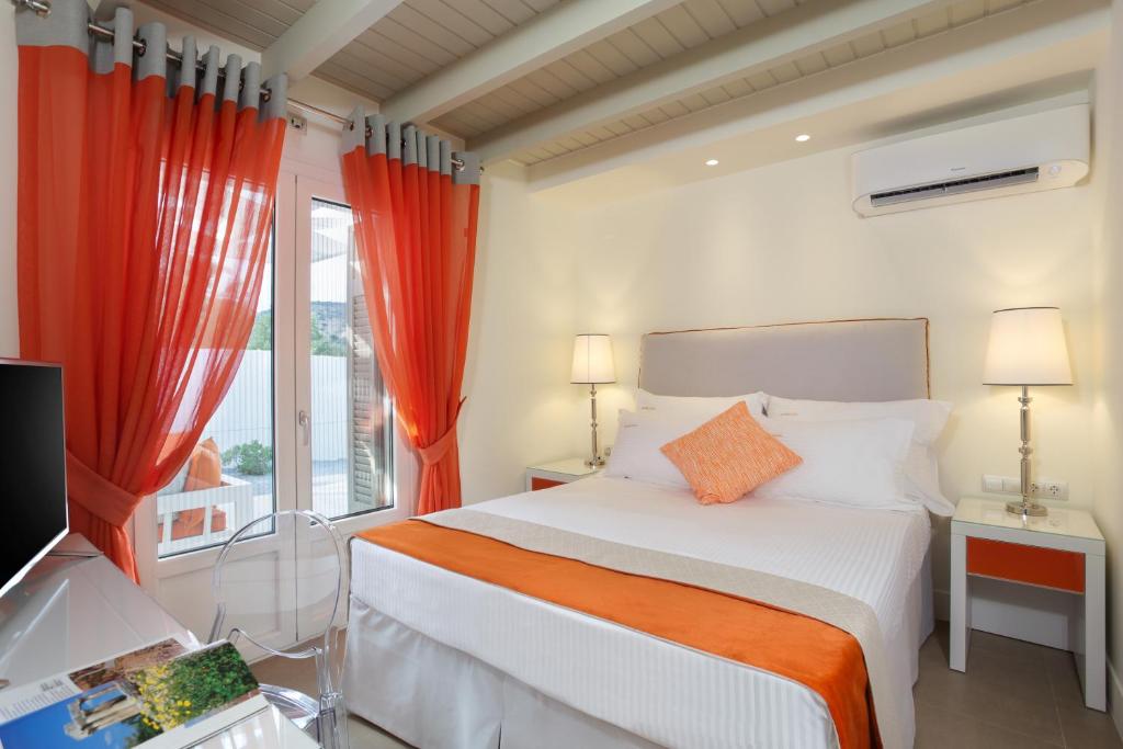 Postel nebo postele na pokoji v ubytování Mareggio Exclusive Residences & Suites