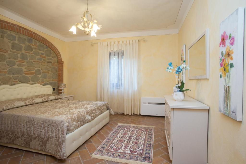 Postel nebo postele na pokoji v ubytování Borgo dei Gigli