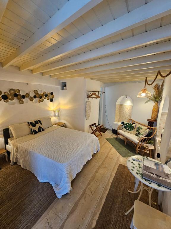 Postel nebo postele na pokoji v ubytování Capparis Studio
