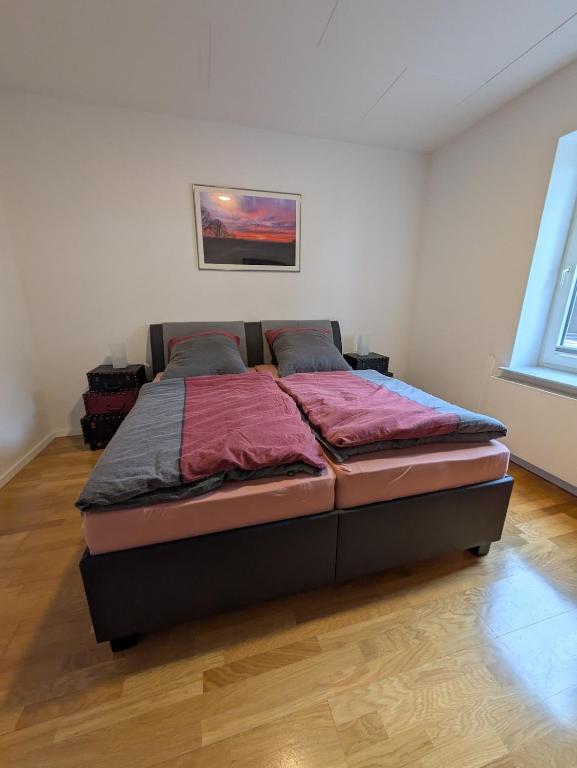 a bedroom with a large bed in a room at Ferienwohnung Seeling Weserbergland in Ottenstein