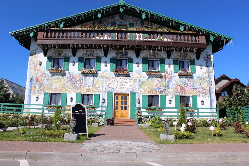 a building with a painting on the front of it at Hotel Muravskiy Trakt in Zhdanov