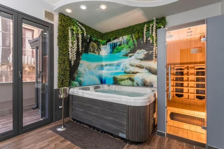 Ένα ή περισσότερα κρεβάτια σε δωμάτιο στο Garibaldi Rooms