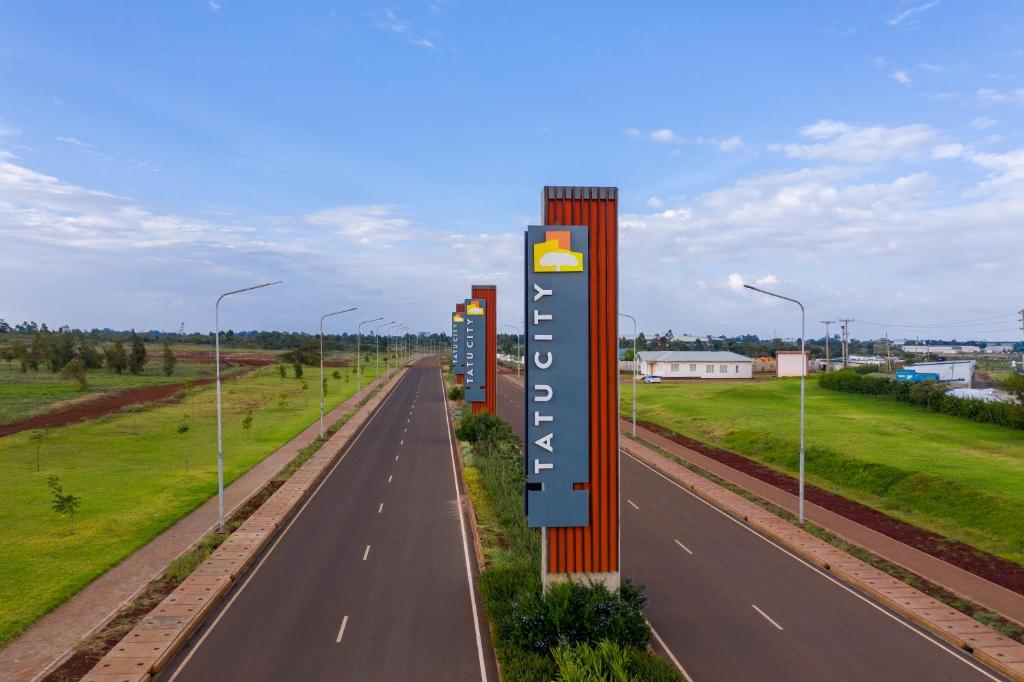 a sign on the side of a highway at Premium Luxury 2-Bedroom Apartment in Tatu City