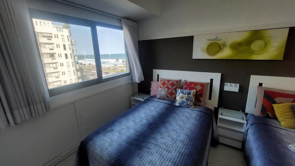 Ένα ή περισσότερα κρεβάτια σε δωμάτιο στο Caribe Carioca