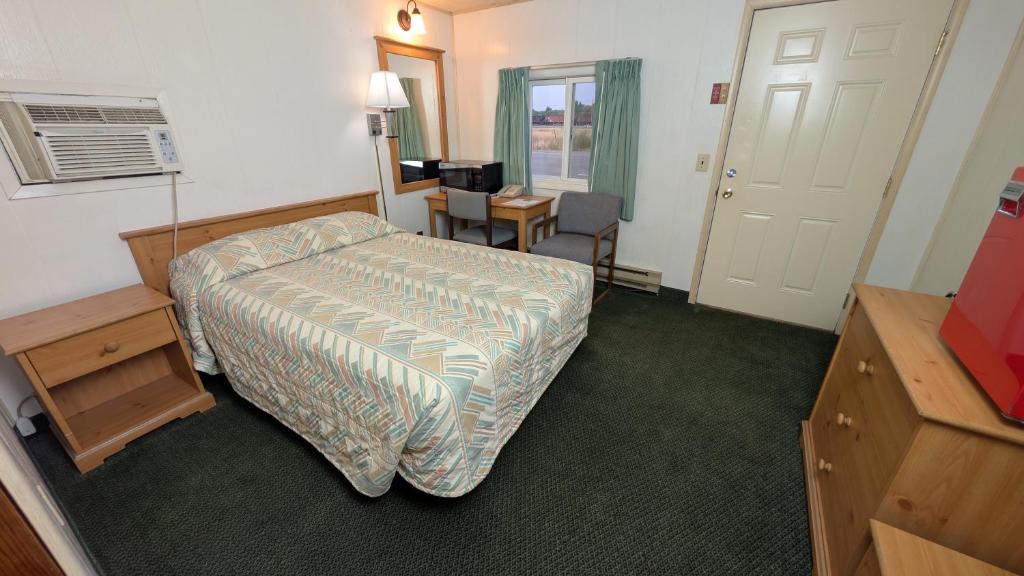 Ένα ή περισσότερα κρεβάτια σε δωμάτιο στο Restwel Motel