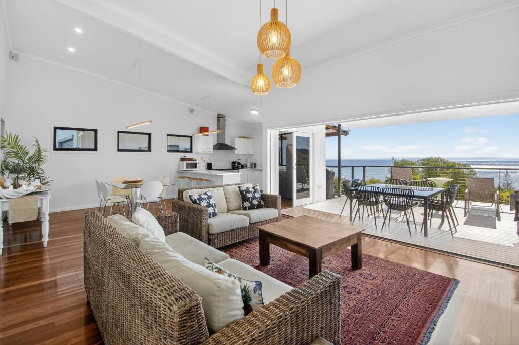 a living room with a couch and a table at Moreton View @ Tangalooma in Tangalooma