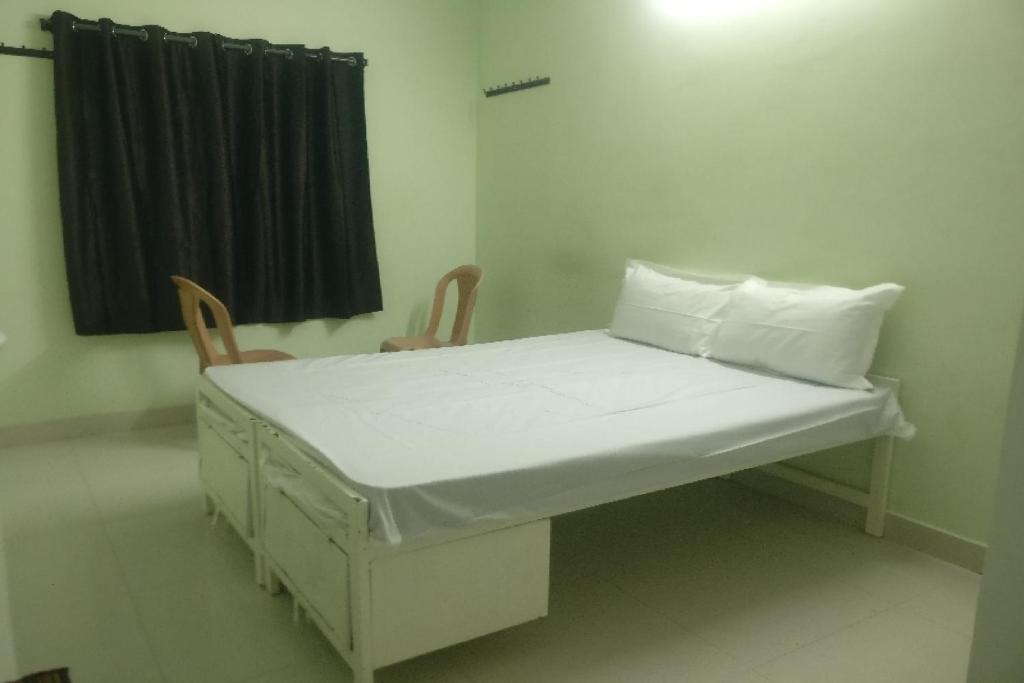 Ένα ή περισσότερα κρεβάτια σε δωμάτιο στο Hotel O REDDY'S GRAND LUXURY ROOMS