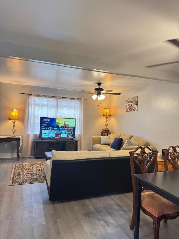 a bedroom with a bed and a flat screen tv at 3 bedroom Town home in Charlotte