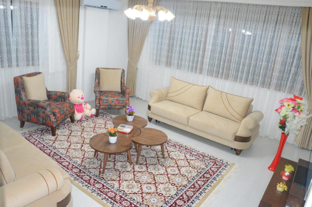 a living room with a couch and a table at Konaklar Apart Premium in Trabzon