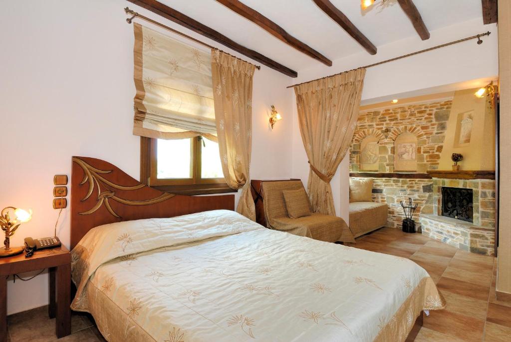 Postel nebo postele na pokoji v ubytování Nikolaou House