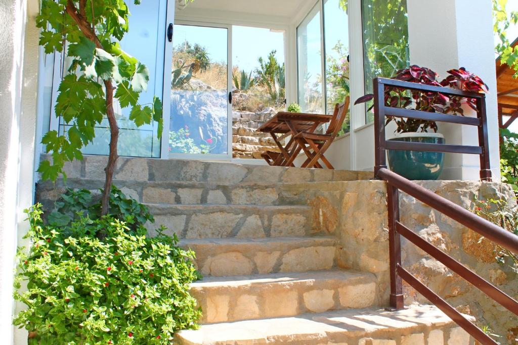 a set of stairs in front of a house at Apartments Villa Milna 1 in Budva