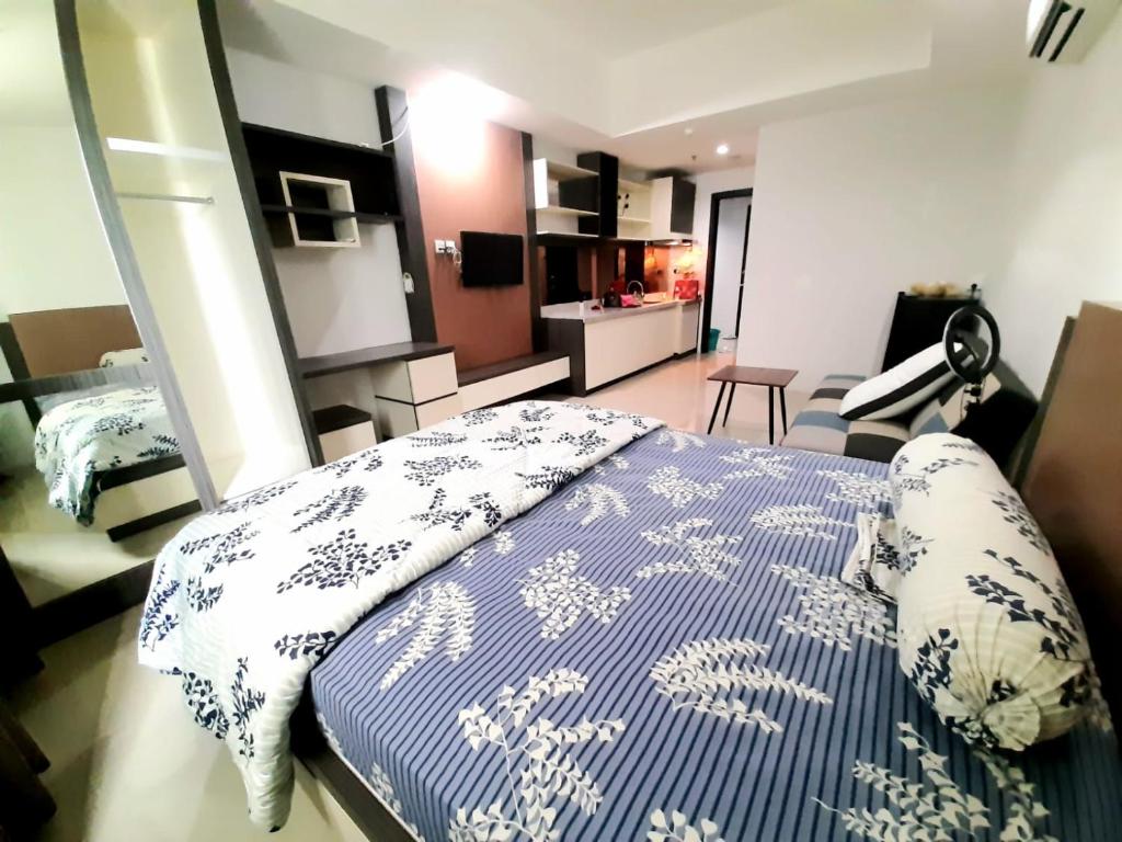 Ένα ή περισσότερα κρεβάτια σε δωμάτιο στο NAGOYA MANSION & Residence