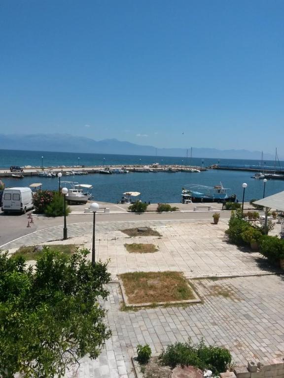 a view of a harbor with boats in the water at Drakopanagiotaki Rooms in Agios Andreas