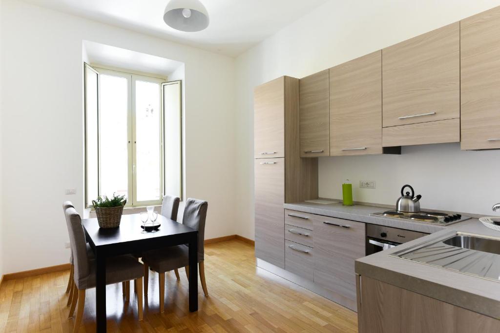 Kuchyň nebo kuchyňský kout v ubytování CS Cosy Termini Apartment