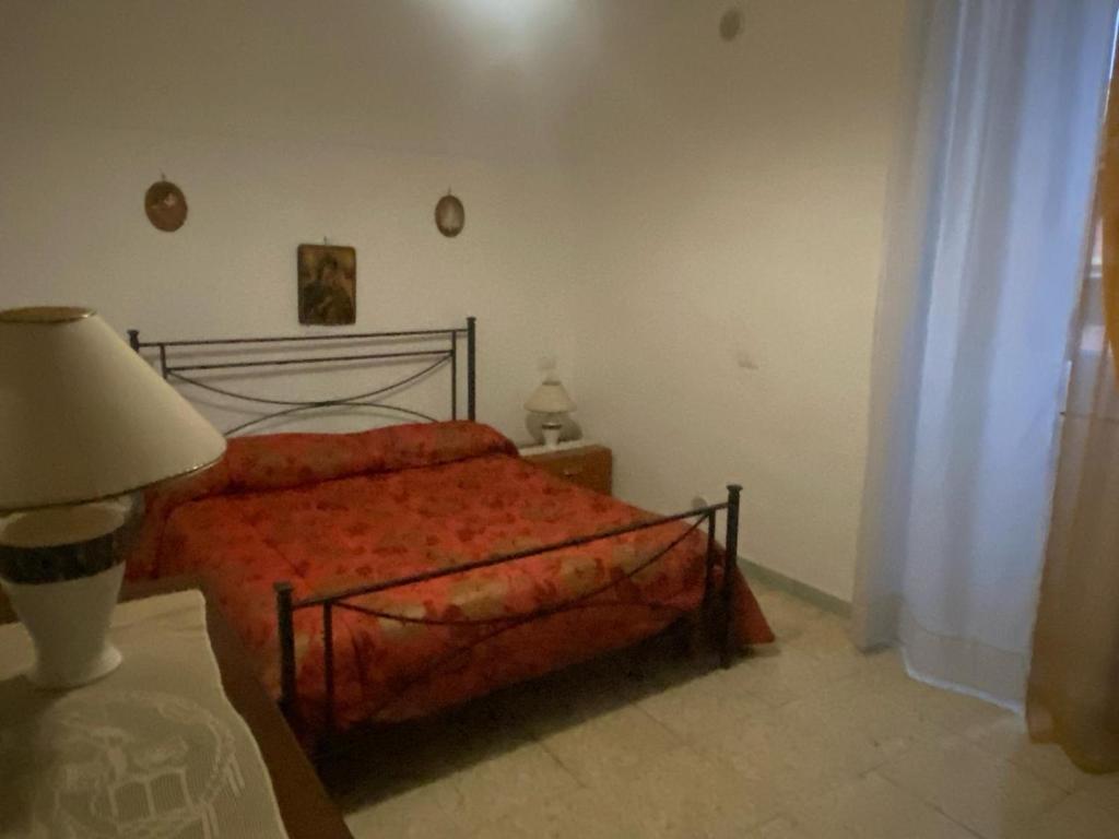 Ένα ή περισσότερα κρεβάτια σε δωμάτιο στο La Taverna