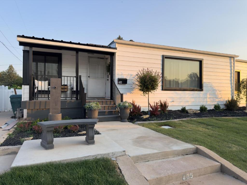 a house with a bench in front of it at Vernal Sport-Court Base Camp in Vernal