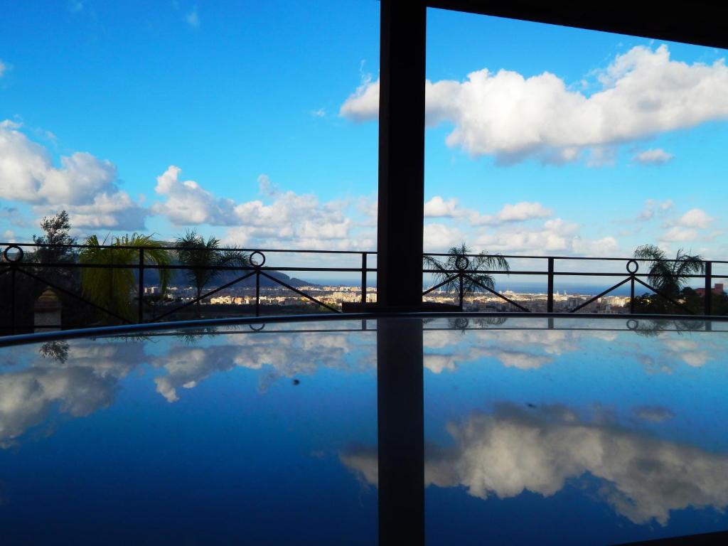 a view of the sky and clouds from a balcony at B&B Sole e Luna in Palermo