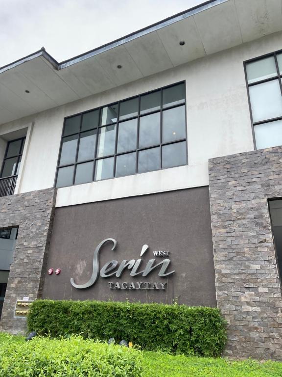 a sign on the side of a building at Relaxing Escape lovely STUDIO unit with a pool in Tagaytay