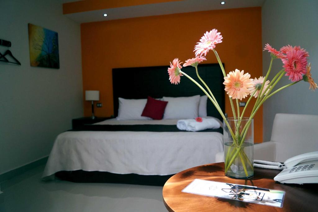 Postel nebo postele na pokoji v ubytování Hotel Casa Palomino