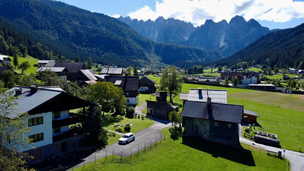 an aerial view of a village with mountains in the background at Neuhaus Apartments in Gosau